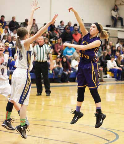 Taking the outside jump shot, Junior Jacey Murphy (dark jersey) takes a jumper against North Park. The Mustangs won a close one, 49-47. photo credit Kim Bodemann