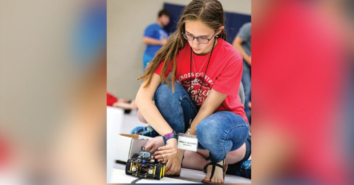 photo by Adam Fondren, Rapid City Journal | Jessica Gregory starts her robot on one of the four challenges of the competition at the Electrifying Robotics summer camp for high school students at the South Dakota of Mines and Technology in Rapid City. photo by Adam Fondren, Rapid City Journal | Jessica Gregory starts her robot on one of the four challenges of the competition at the Electrifying Robotics summer camp for high school students at the South Dakota of Mines and Technology in Rapid City.