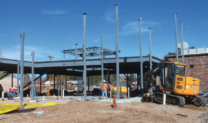 photo by Marissa Lorenz Construction is well underway at Middle Park Health’s Kremmling Campus. Steel girding has been seen rising into the sky. The yellow sheeting indicates where cement was to be laid this week for the first half of the facility’s new slab. And builders and machinery, such as a remote-controlled compactor, can be seen hard at work. The Kremmling expansion project is anticipated to finish on-time and on-budget in late spring or early summer 2021.