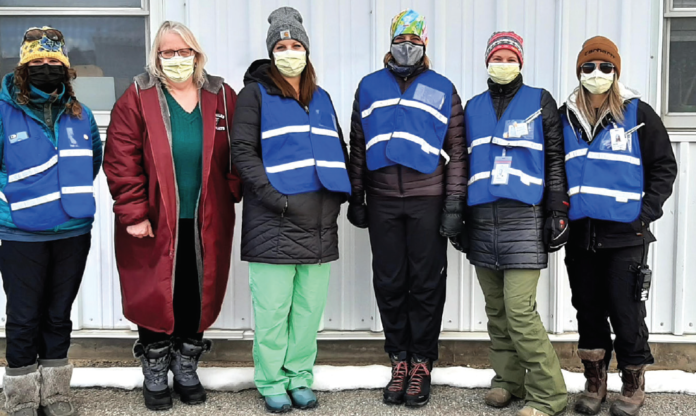 photo courtesy of Middle Park Health A drive through vaccination clinic is being offered at the fairgrounds in Kremmling. Currently those 70 and over are eligible to receive the anti- Covid 19 vaccine. Middle Park Health staff and volunteers come bundled for the frigid temperatures (L to R) Caityln Taussig, Deb Plemmons, Mabon Acord, Kim McMahon, Lyndsey Stuerman and Kayla Boyd. photo courtesy of Middle Park Health A drive through vaccination clinic is being offered at the fairgrounds in Kremmling. Currently those 70 and over are eligible to receive the anti- Covid 19 vaccine. Middle Park Health staff and volunteers come bundled for the frigid temperatures (L to R) Caityln Taussig, Deb Plemmons, Mabon Acord, Kim McMahon, Lyndsey Stuerman and Kayla Boyd.