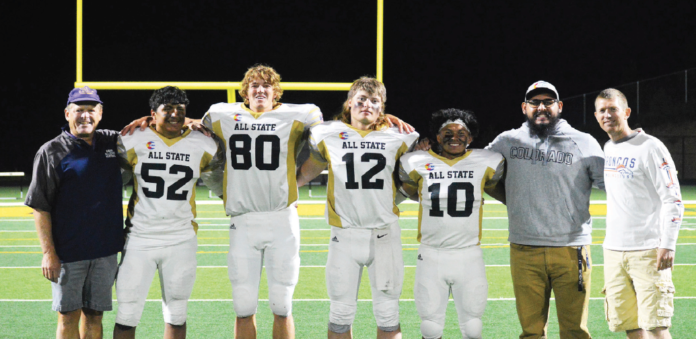 photo by Andrea Buller | The four All-State Mustangs pose with their West Grand coaches. (L to R) Coach Chris Brown, Alejandro Castanon, Austin Schake, Jakob Buller, Rene Dominguez, Coach Fernando Enriquez and Josh Pedersen. Over 60 Mustang fans traveled to Blackhawk to watch the All-State game. photo by Andrea Buller | The four All-State Mustangs pose with their West Grand coaches. (L to R) Coach Chris Brown, Alejandro Castanon, Austin Schake, Jakob Buller, Rene Dominguez, Coach Fernando Enriquez and Josh Pedersen. Over 60 Mustang fans traveled to Blackhawk to watch the All-State game.